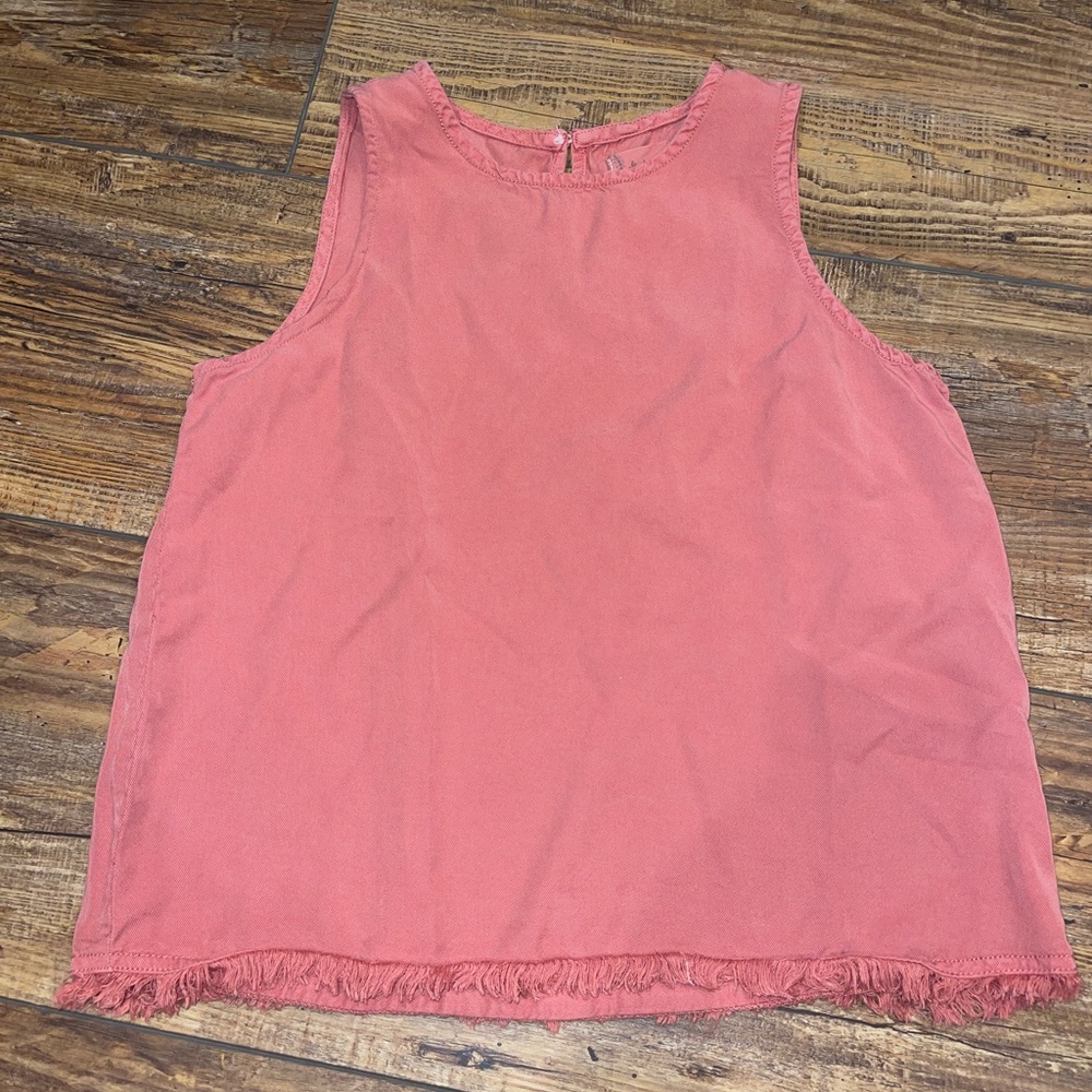 Coral sleeveless top with fringe on the hem
